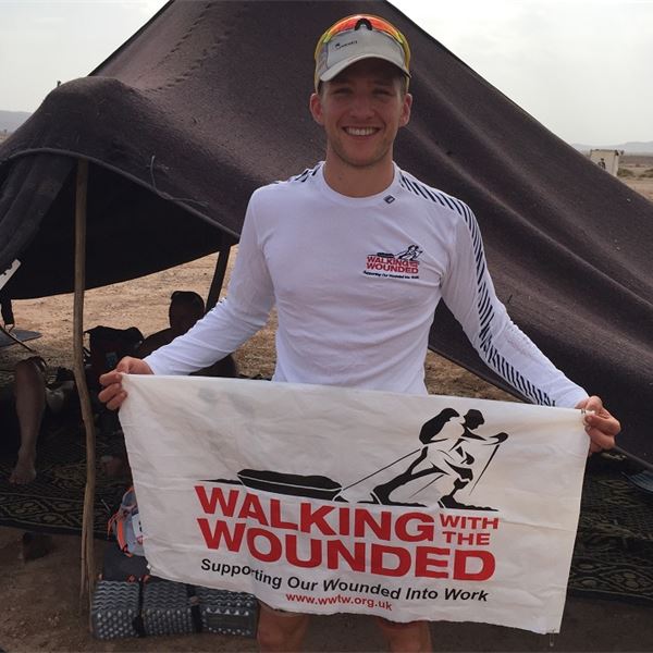 Tom Evans - MdS 2017 - Marathon des Sables - Tom Evans with a Walking With The Wounded flagArmy Benevolent Fund - Injured servicemen charity